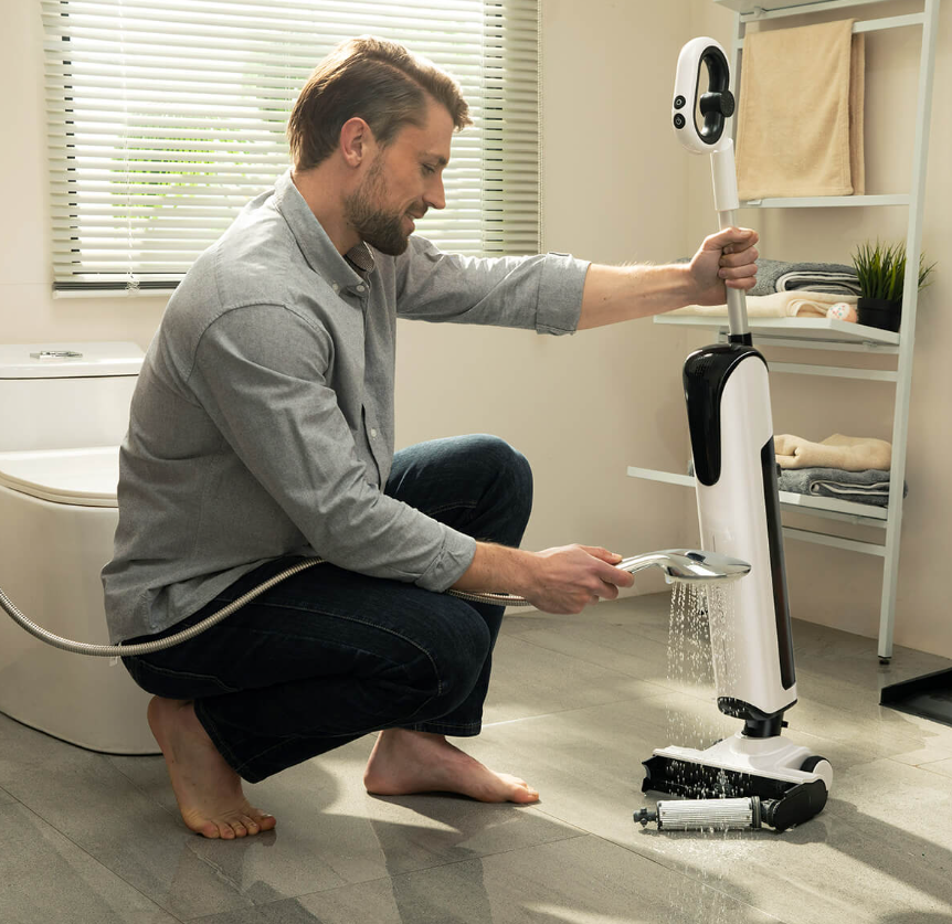 man washing cleaning motor
